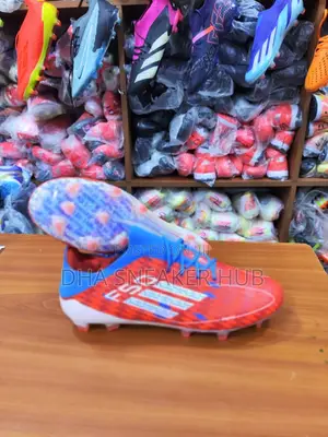 Football Boots/Soccer Boots of Red, Blue and Adidas Stripes