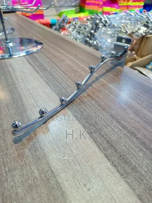 Wall-Mounted Clothes Hanger Rack.