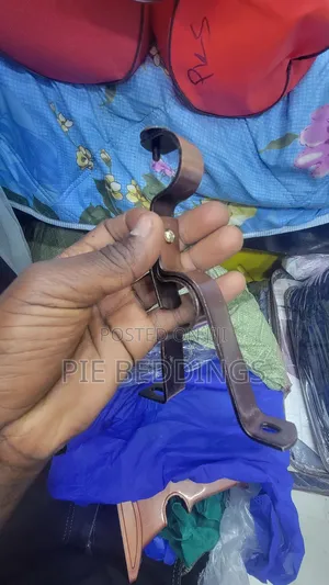 A Pair of Metallic Curtain Holders