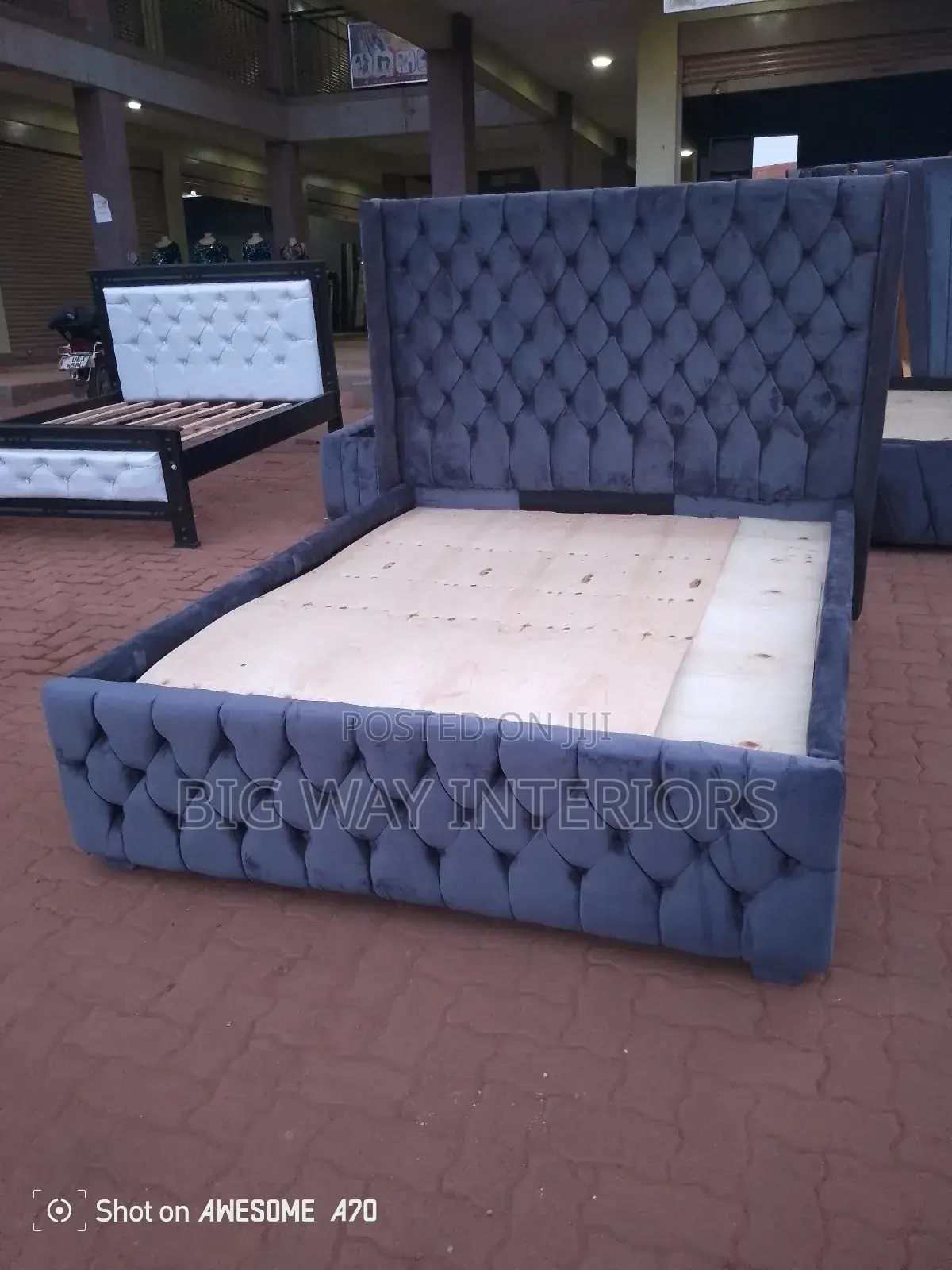 5by6 Gray Tufted Bed With Buttons at the Back