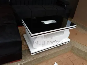 White Center Table With a Black Line Design