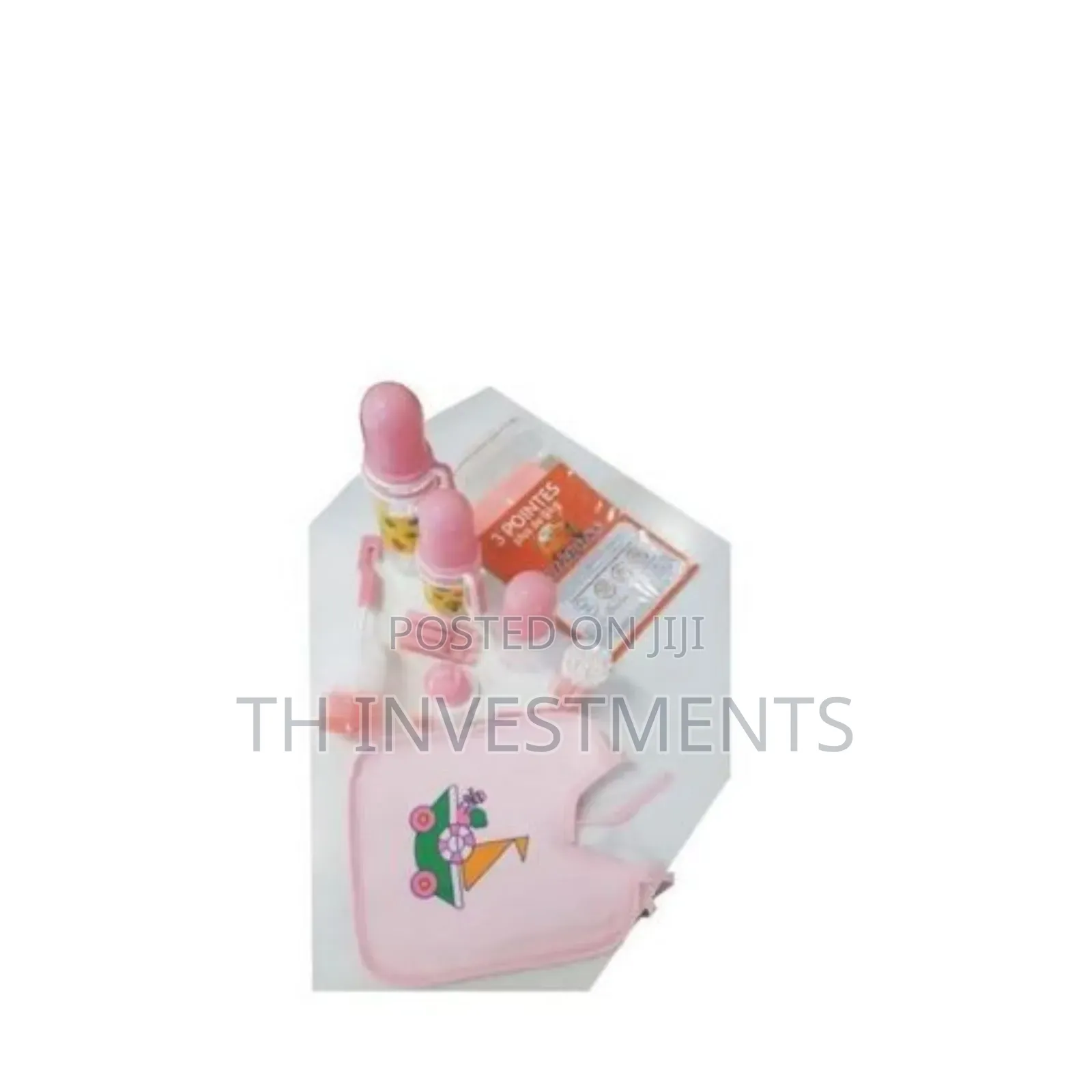 A Set of Three Baby Bottles With Helpers 