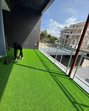 Green Artificial Grass Carpet Sold in Square Meters.