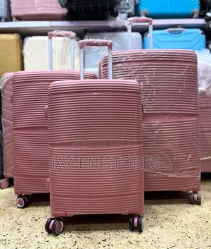 A Set of Lined Black Rubber Suitcases