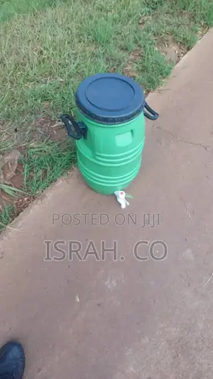 A Plastic Handwashing Water Tank With a Tap.