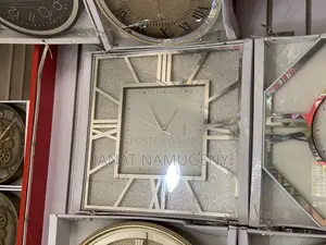 Decorative Wall Clock With Roman Numerals Display