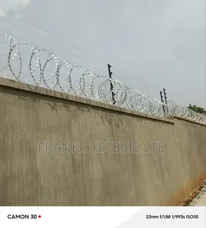 Photo - Electric Fence System With Razor Wire