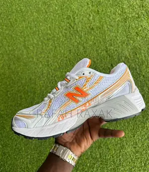 Original White/Orange New Balance 740 Sneakers