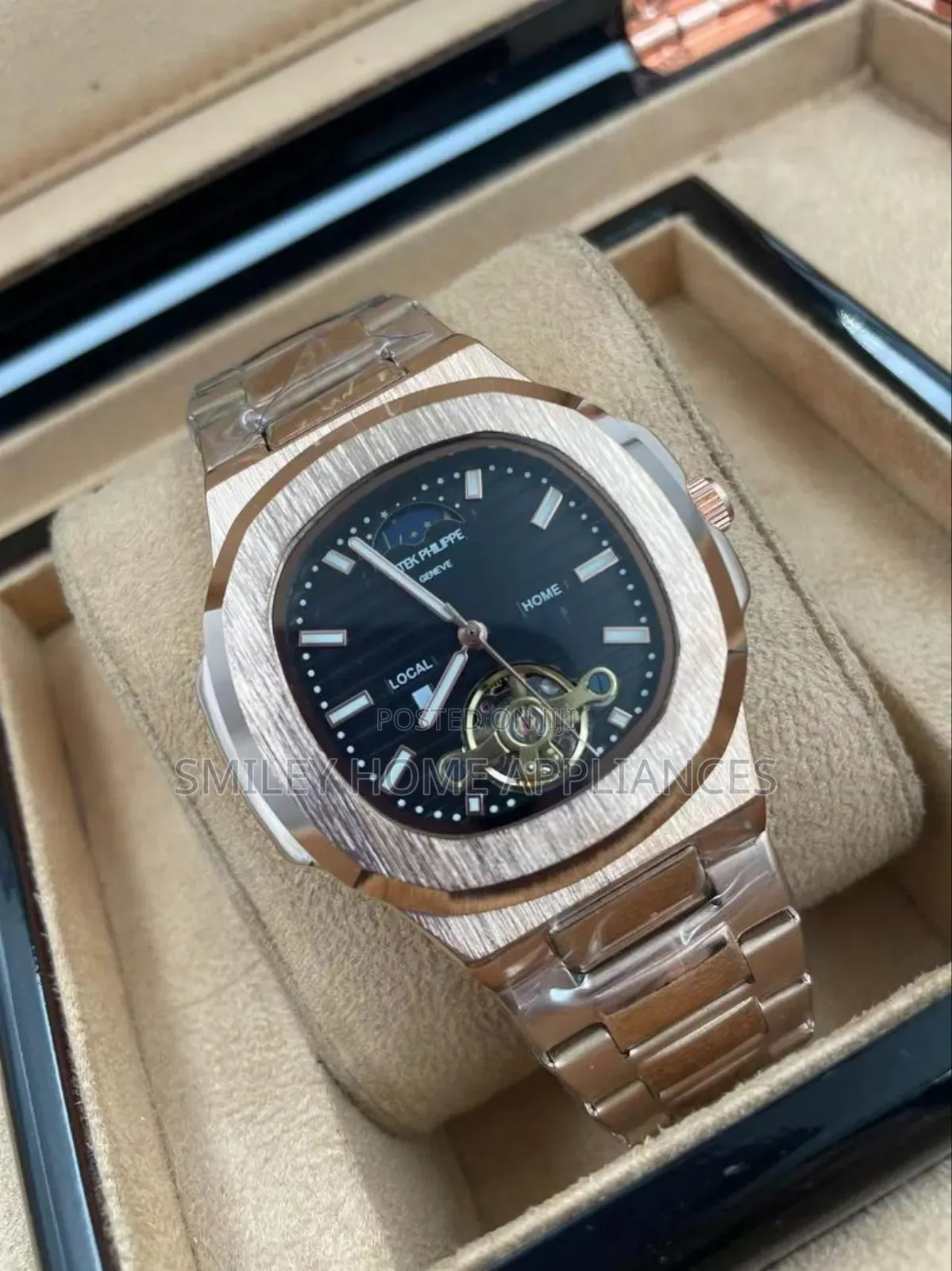Patek Phillipe Rose Gold Analog Watchbwith a Black Face