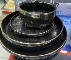 A Black and Gold Dinnerware Set,