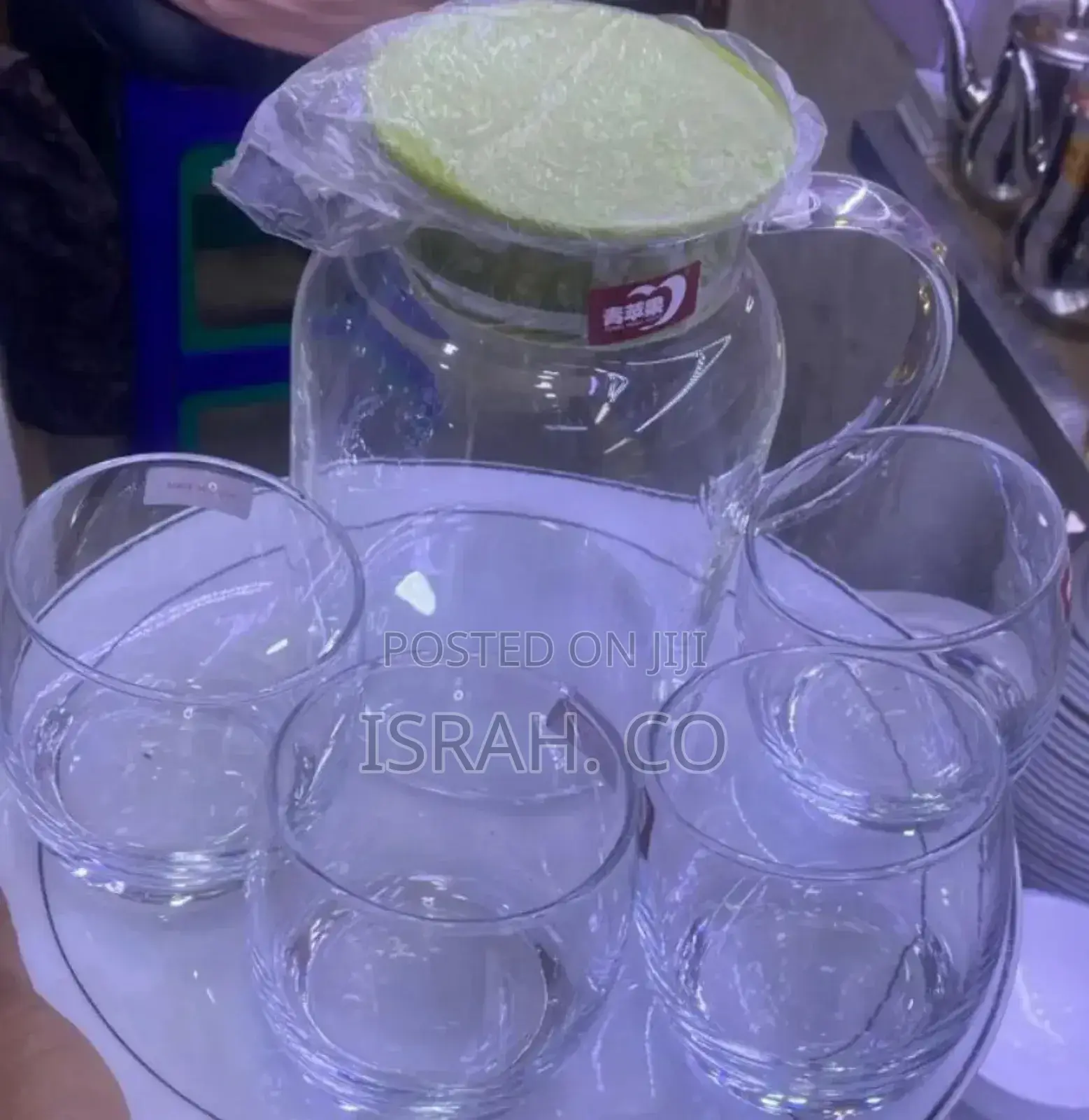Set Consisting of a Glass Pitcher and Four Clear,Round Glass