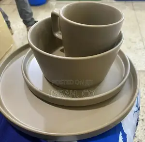 Set of Ceramic Dinnerware in a Neutral, Light Brown Color.