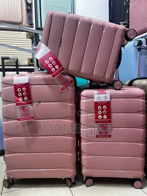 A Set of Shodenly Pink Rubber Suitcases