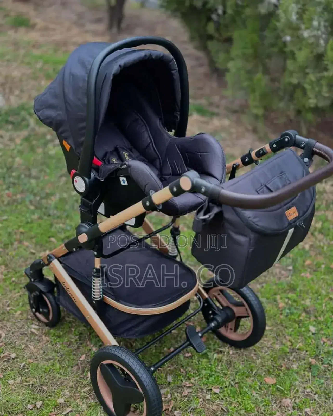 Luxmom 518 3-in-1 Stroller in Black and Gold.