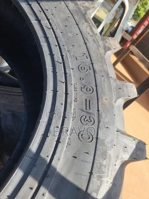 16.9 - 30 Tractor Tyres Behind.