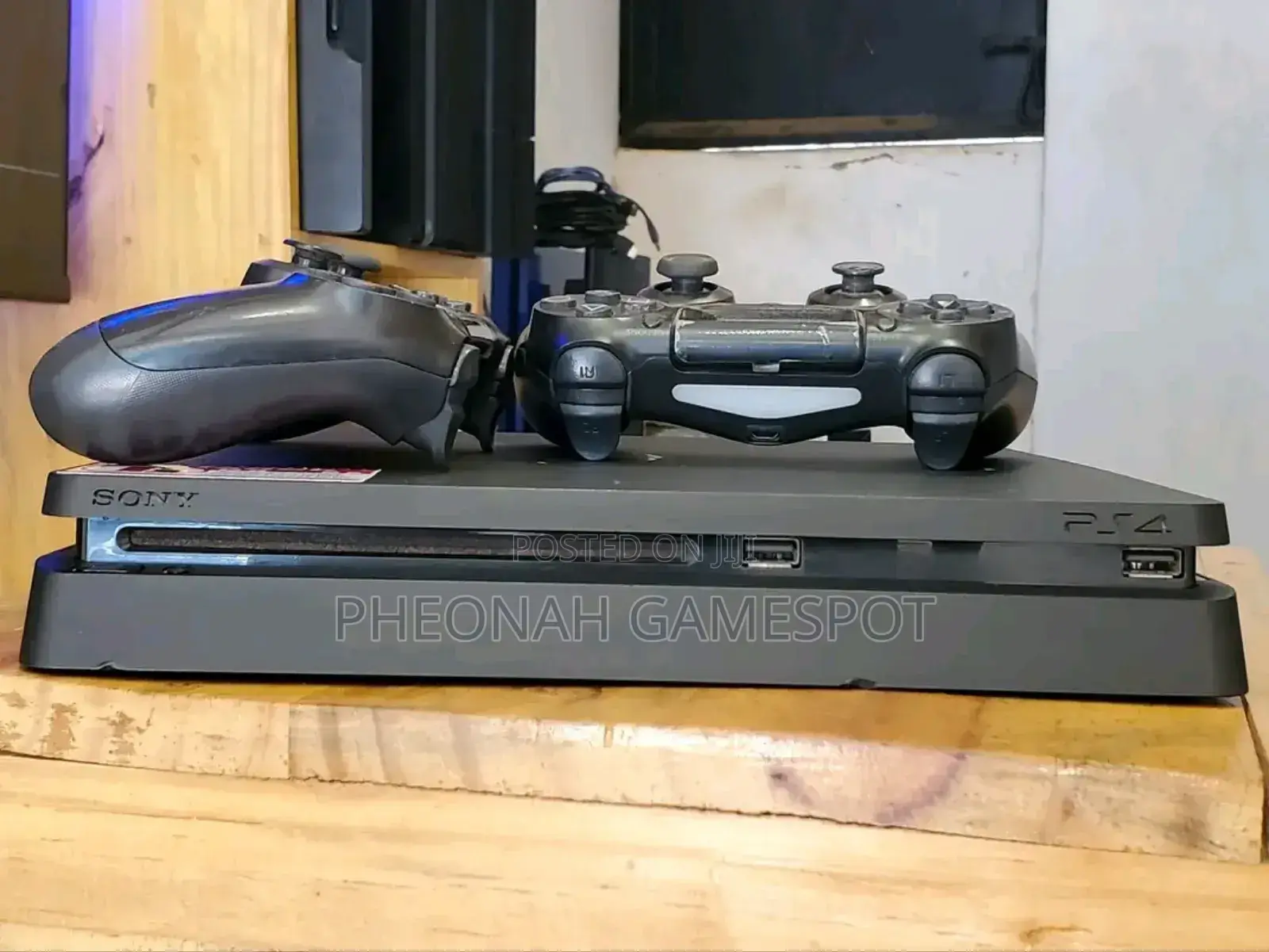 Playstation 4 Slim at Only 850000. With 14 Games and 2 Pads