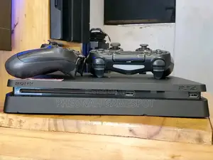 Playstation 4 Slim at Only 850000. With 14 Games and 2 Pads