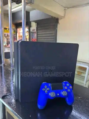Playstation 4 Slim at Only 850000. With 14 Games and 2 Pads