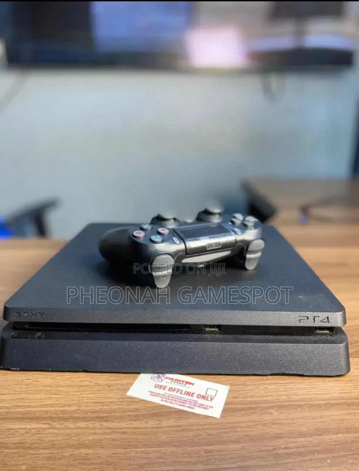 Playstation 4 Slim at Only 850000. With 14 Games and 2 Pads