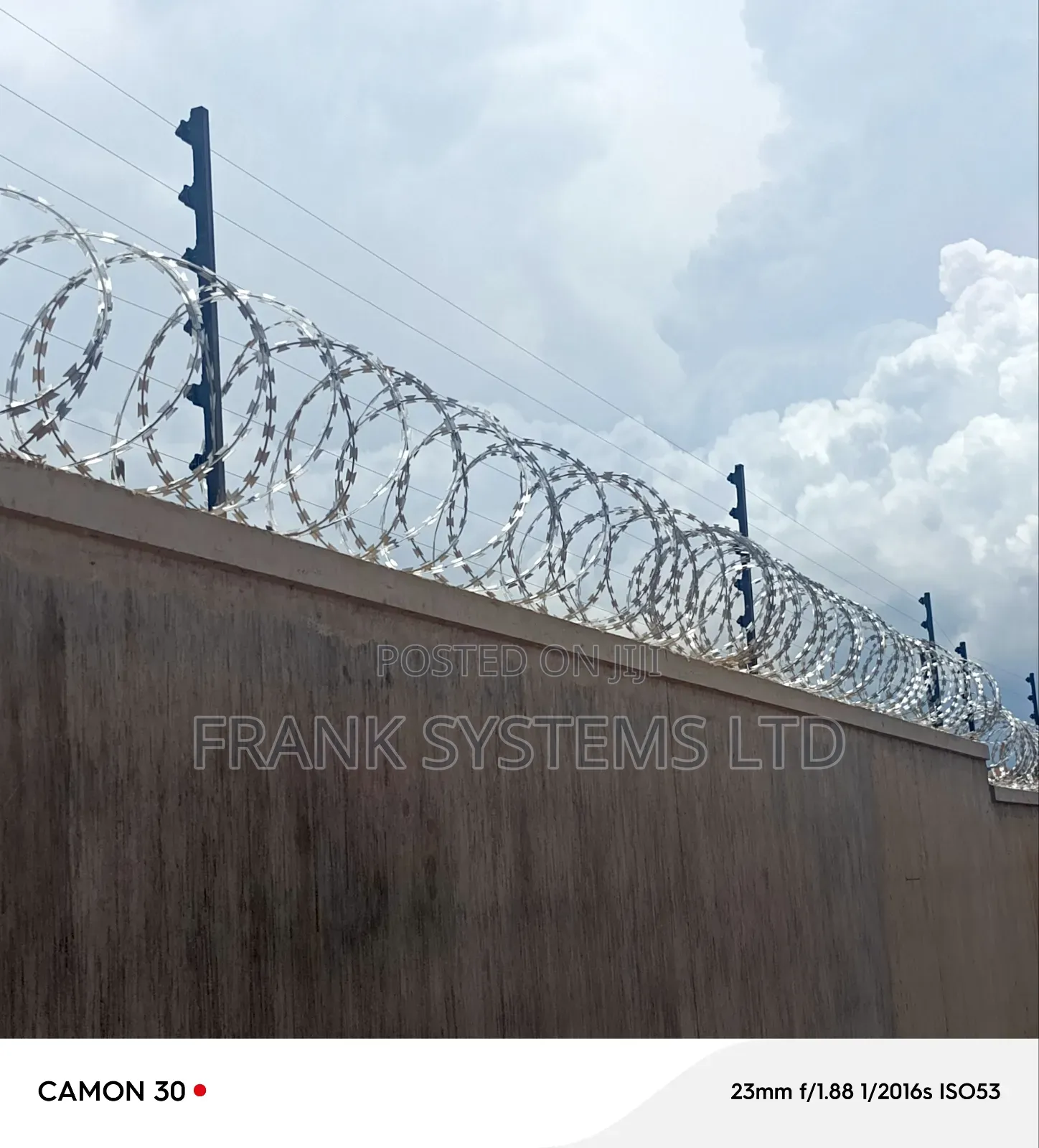 Electric Fence System With Razorwire on Residential House
