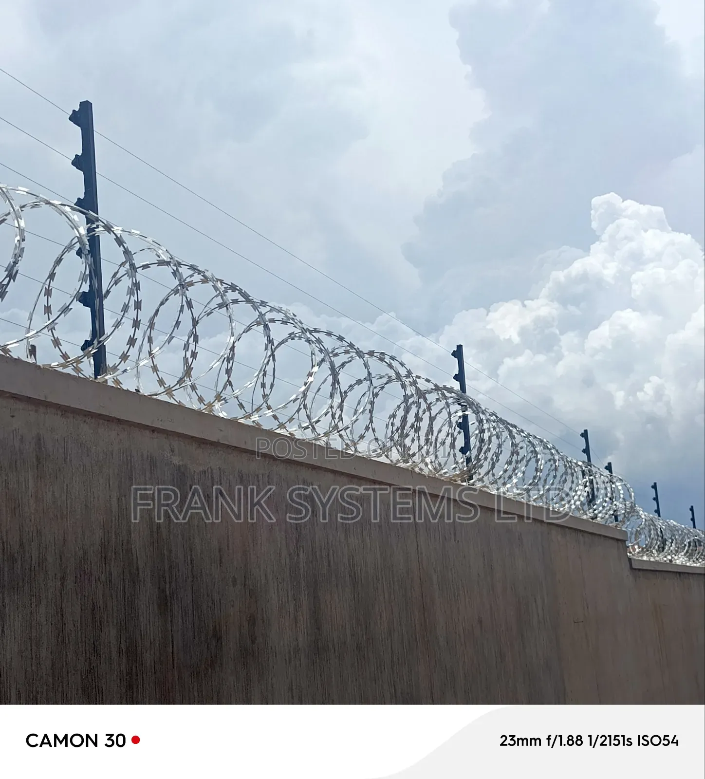 Electric Fence System With Razorwire on Residential House