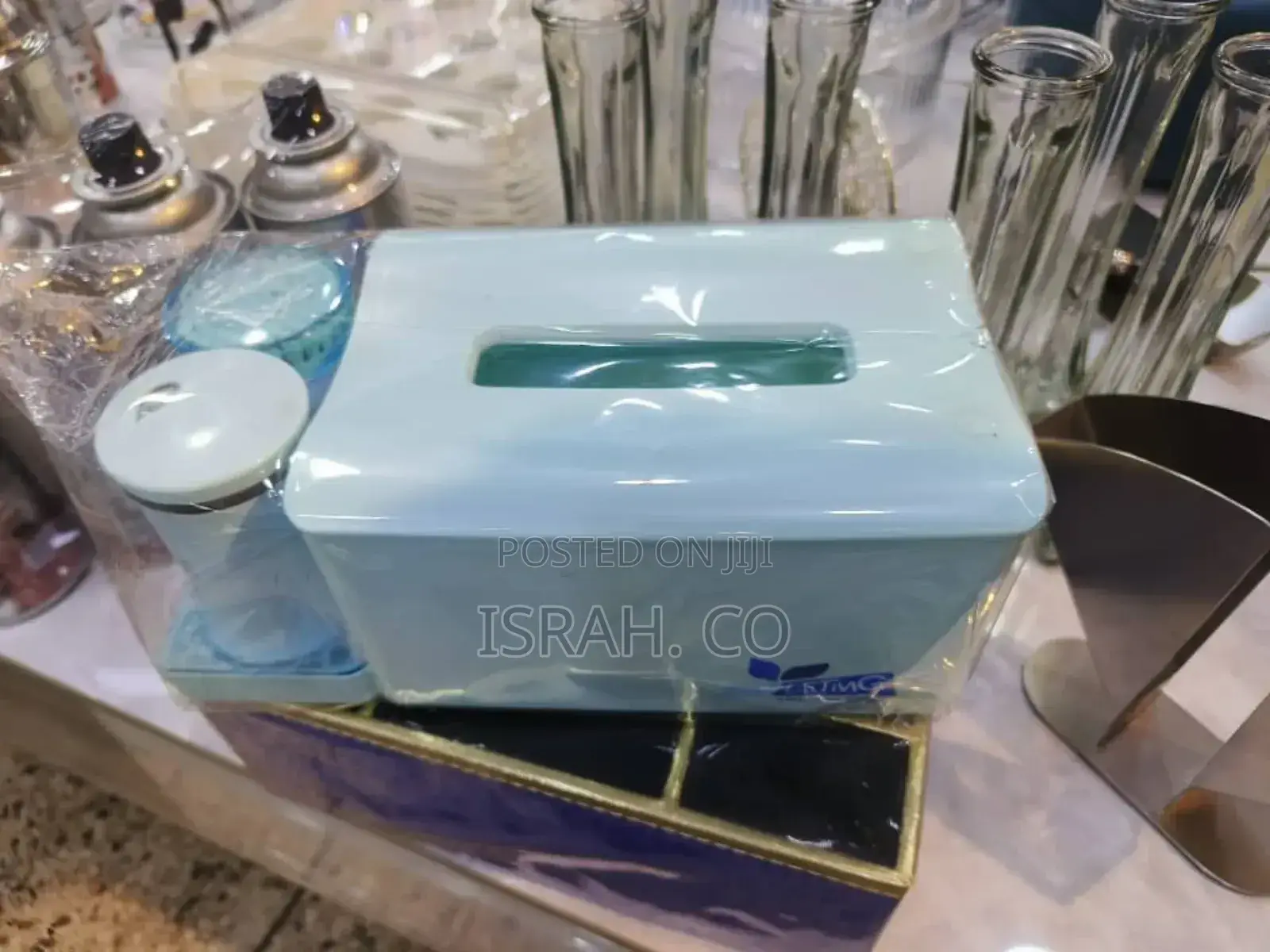 A Tissue Box With an Attached Container