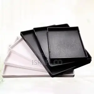 Stack of Black and White Rectangular Melamine Trays