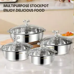 A Set of Stainless Steel Cooking Pots With Glass Lids