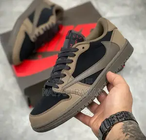 Photo - Original Brown Nike Air Jordan 1 Low X Travis Scott Sneakers