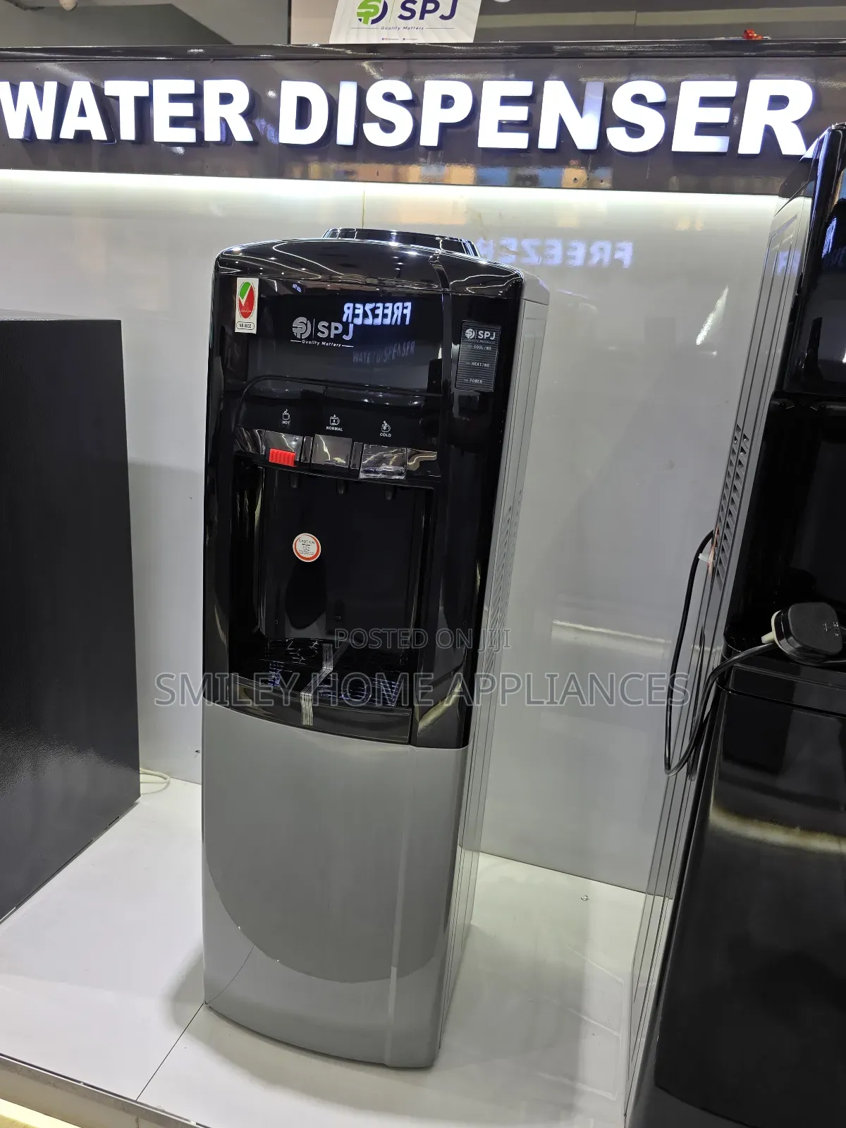 SPJ 3 Tap Water Dispenser With a Refrigerator at the Bottom