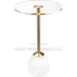 Photo - Clear Acrylic Side Table With a Brushed Brass Meta Base.