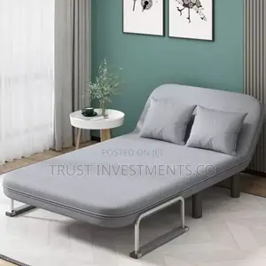Photo - Gray Folding Sofa Which Can Be Used as a Chair or a Bed.