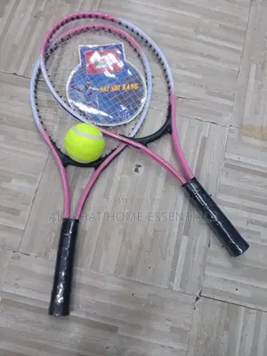 A Set of Tennis Racket With a Tennis Ball