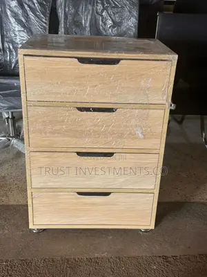 Photo - Light Brown Wooden Filing Cabinet With Four Drawers