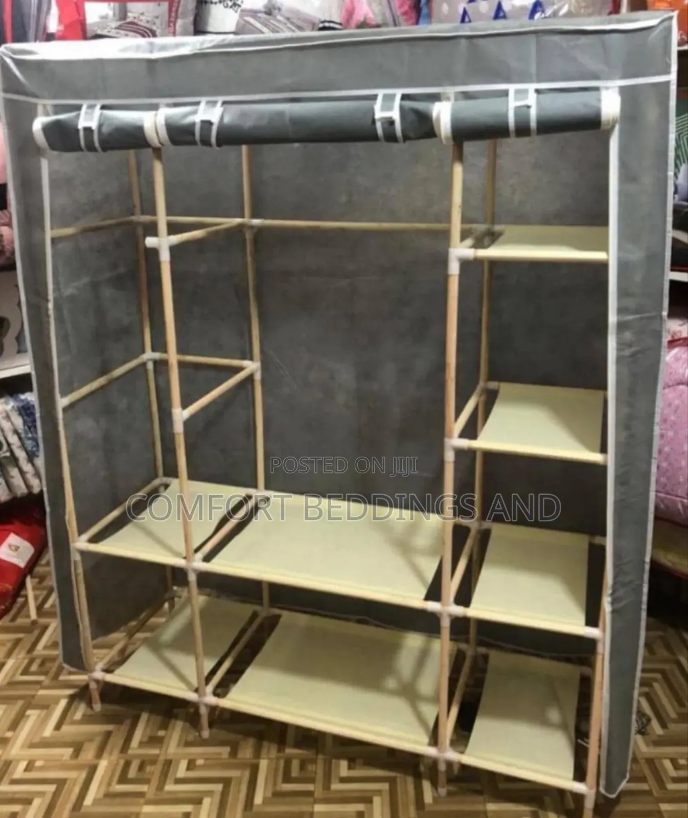 Three Column Wooden Closet With a Cloth
