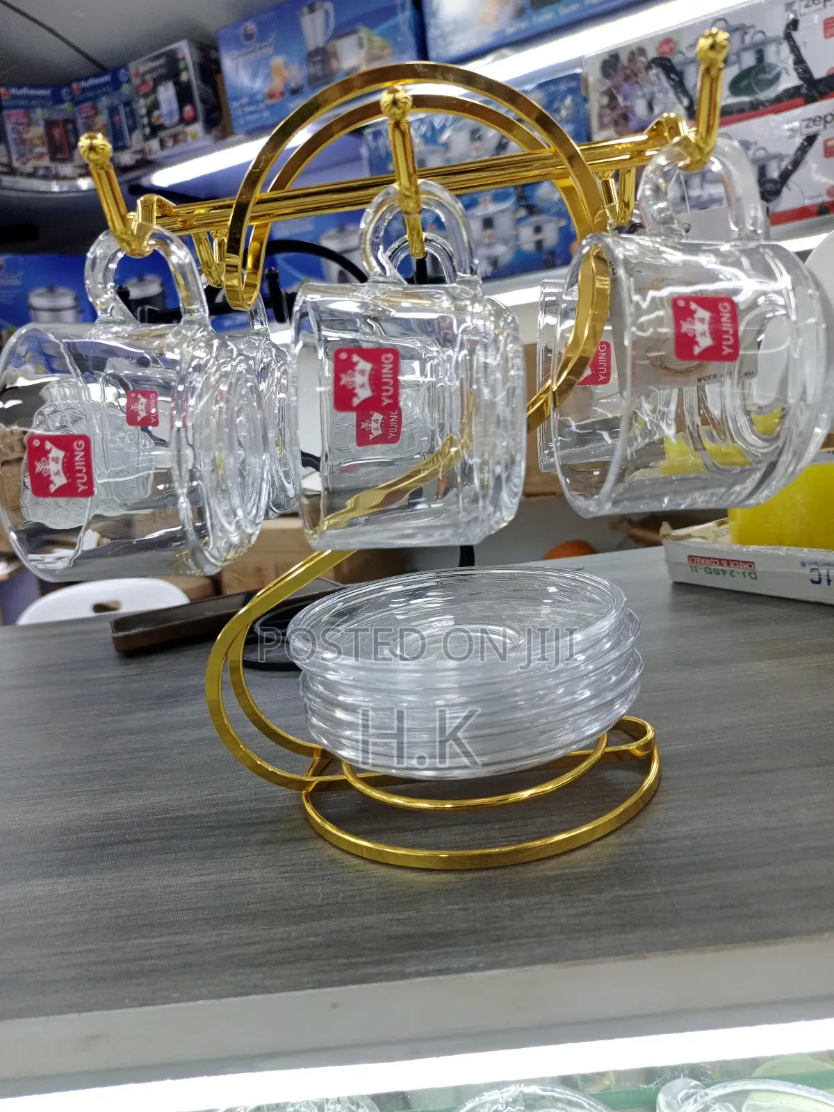 Glass Teacups and Saucers + Gold-Colored Metal Stand.