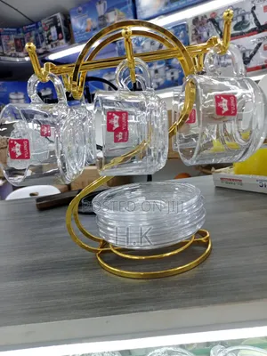Glass Teacups and Saucers + Gold-Colored Metal Stand.