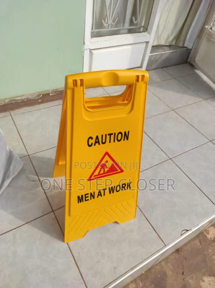 Men At Work Sign Post