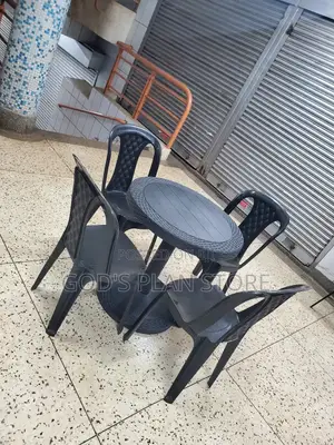 A Set of Round Table and Chairs