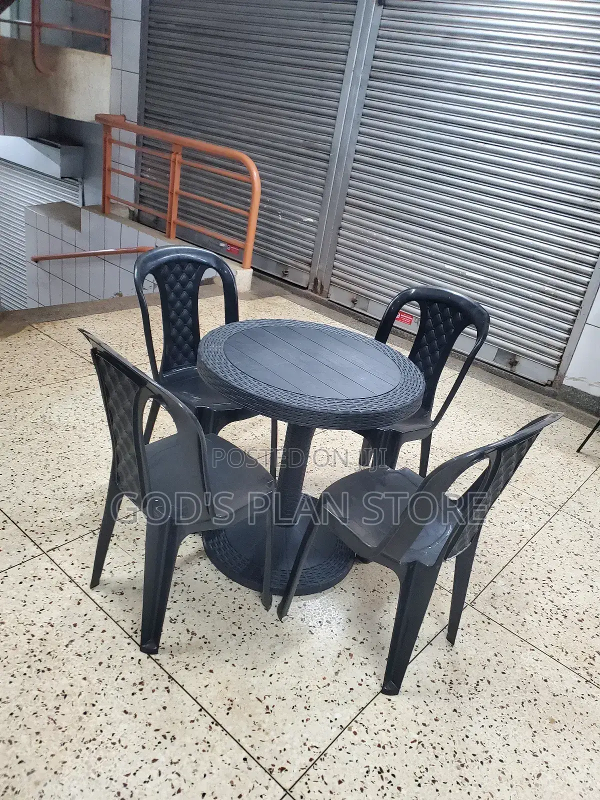 A Set of Round Table and Chairs