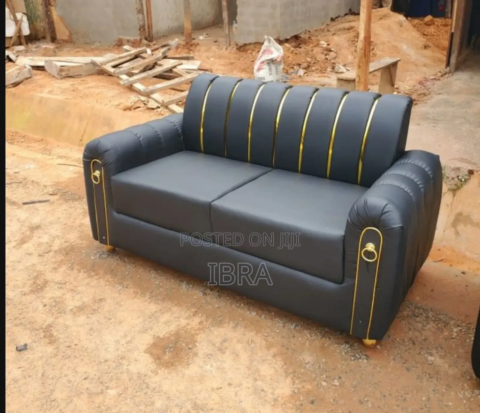 A Leather Two Seater Sofa Set With Gold