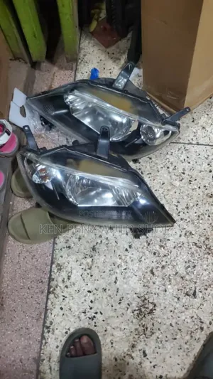 Headlamps for Mazda Demio 2002