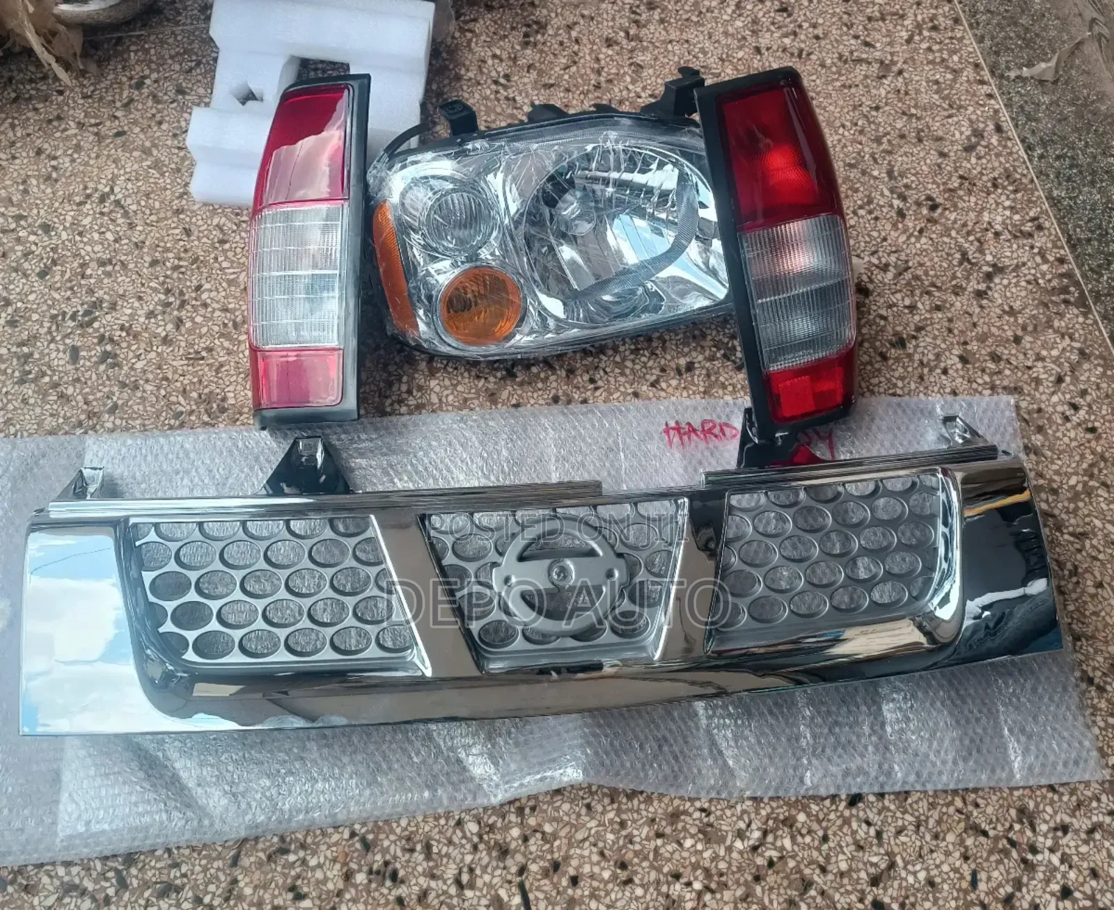 A Set of Headlamps, Taillamps and Grille Hardbody