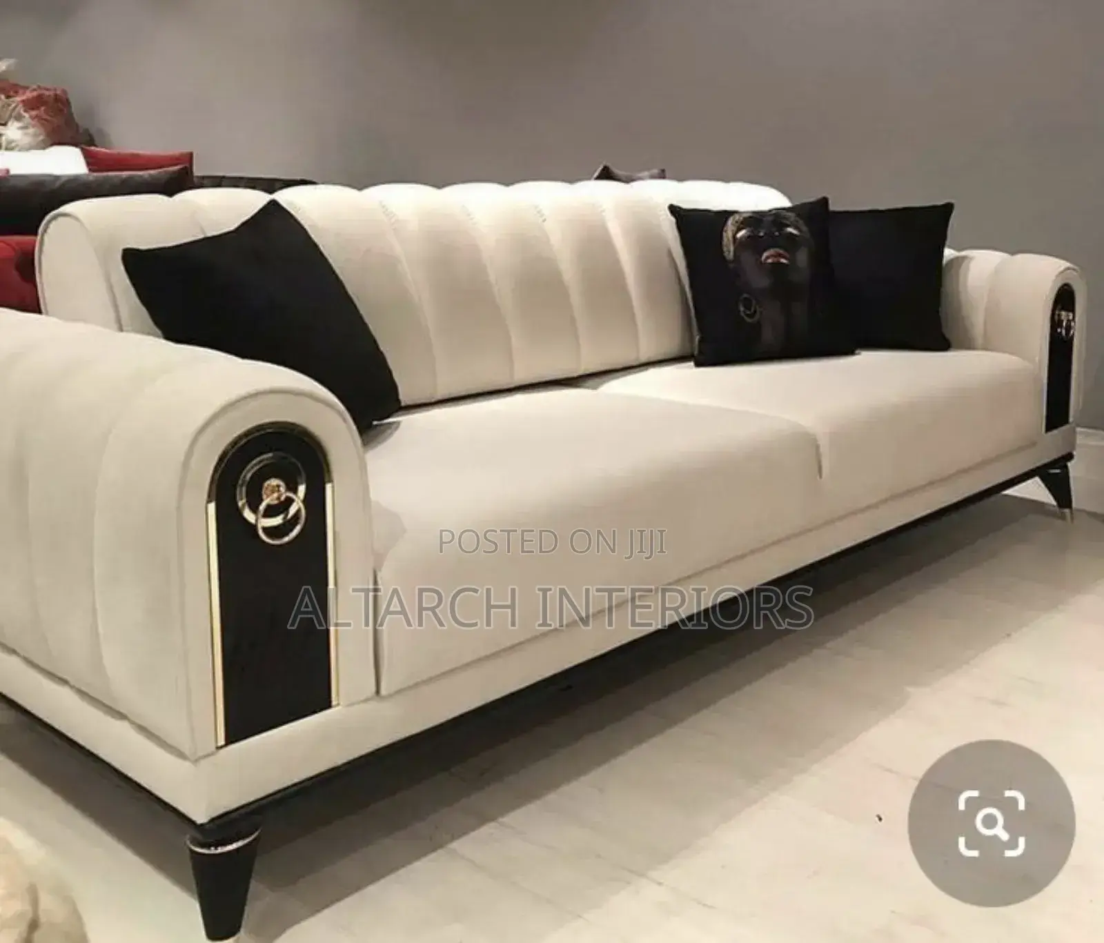 White 2 Seater Sofa With Black Qutions and Legs
