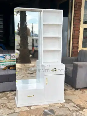 Photo - A White Dressing Mirror With a Storage