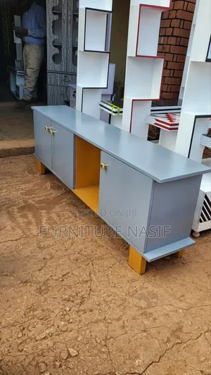 Photo - Gray Stand Tv Available Each