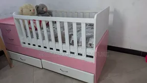 Photo - Pink and White Baby Cot