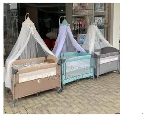 Photo - Baby Travel Cot Bed With Mosquito Net