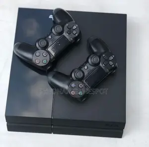 Playstation 4 Standard With 16 Games and 2 Controllers