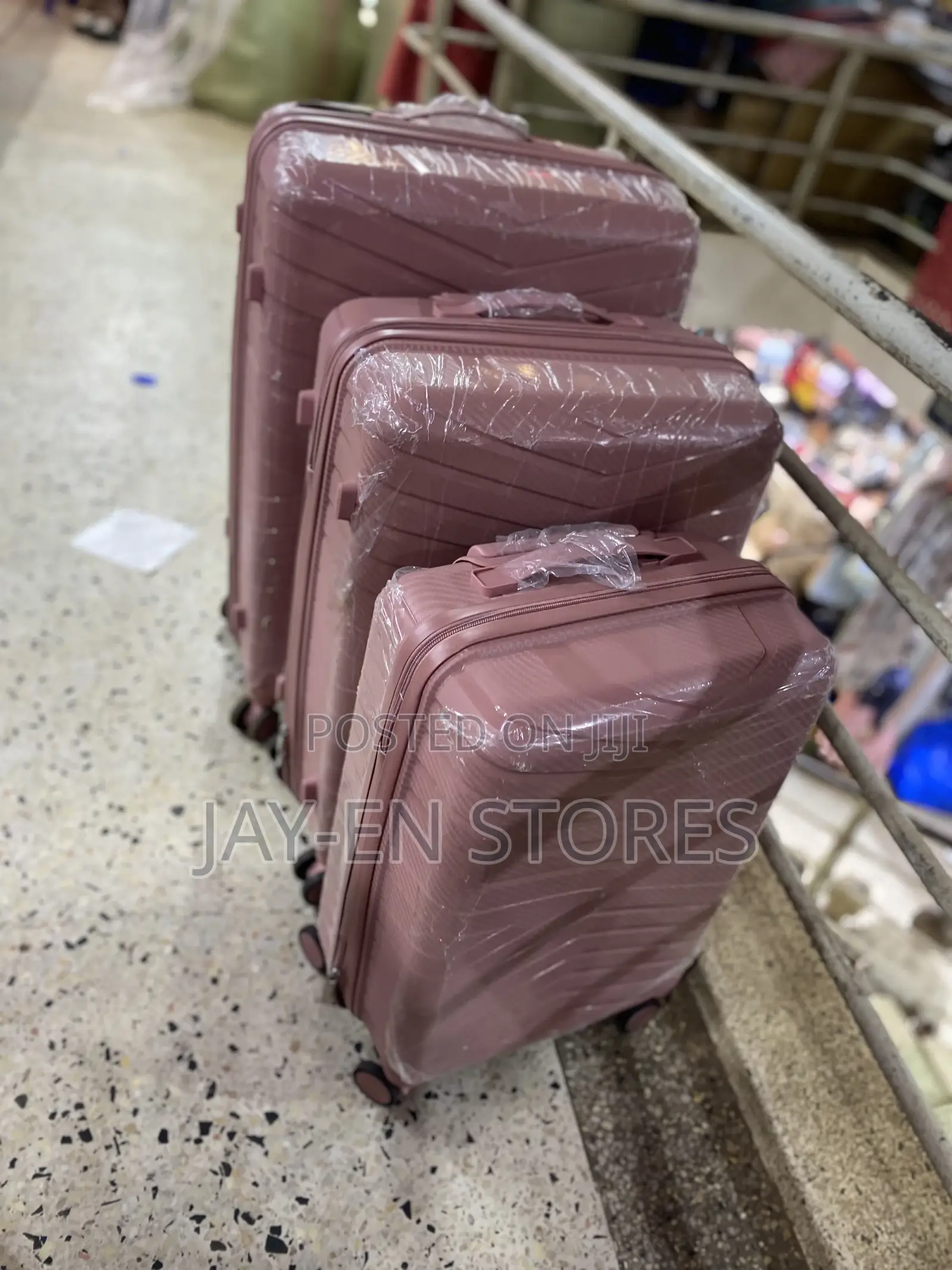 A Set of 3 Rubber Pink Suitcases